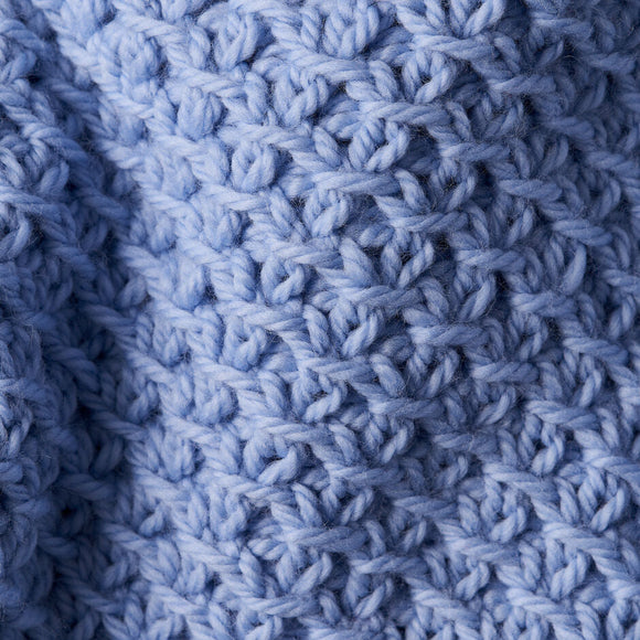 Close-up of a blue knitted fabric texture