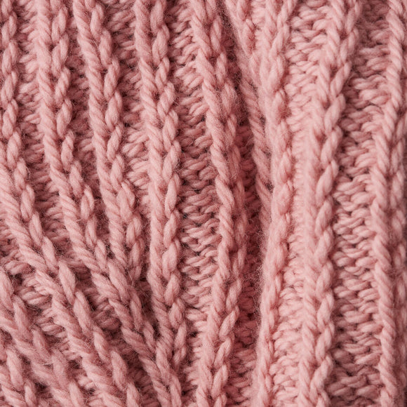 Close-up of pink knitted fabric texture
