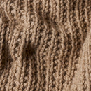 Close-up of beige knitted fabric texture