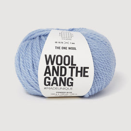 Blue yarn ball with 'Wool and the Gang' label on a white background