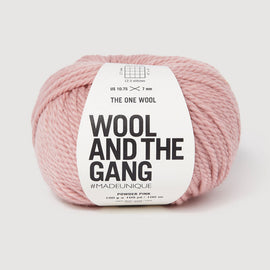 Ball of pink yarn with 'Wool and the Gang' label on a white background