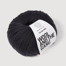 Ball of yarn with 'Wool and the Gang' label on a light gray background