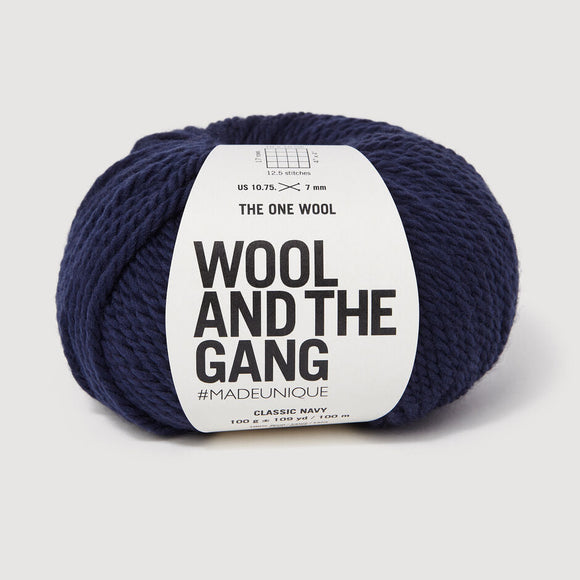 Navy skein of yarn with 'Wool and the Gang' label on a light gray background