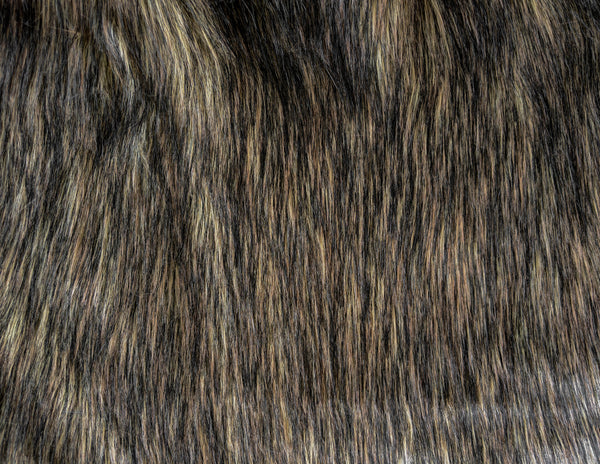 Long pile natural brown faux fur fabric laid flat.