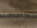 Backing of brown faux fur fabric showing the long pile length of the fake fur.