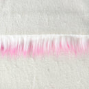 Backing of bubblegum faux fur fabric showing the long pile length of the fake fur.  The color bubblegum has a white base with pink tips.