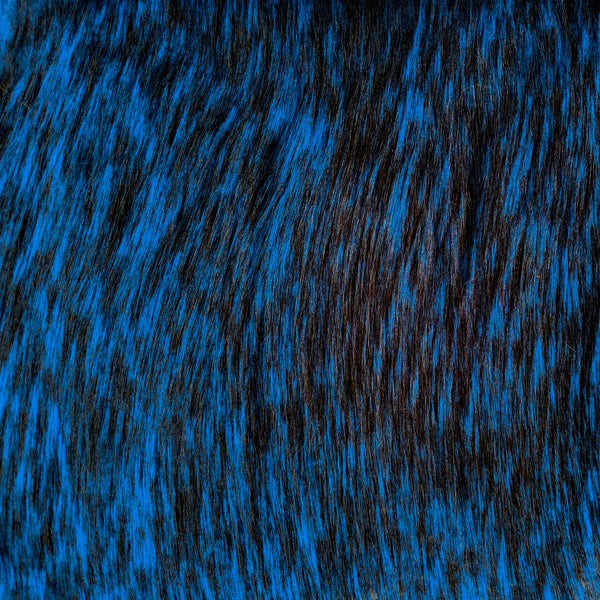 Long pile cobalt blue faux fur fabric laid flat.