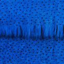 Backing of cobalt blue faux fur fabric showing the long pile length of the fake fur.