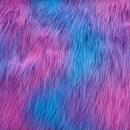 Long pile dreamsicle faux fur fabric laid flat. Dreamsicle has a light blue base with purple and pink streaks  throughout.