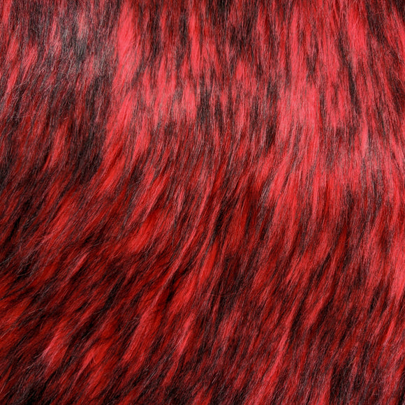 Long pile fire red faux fur fabric laid flat.