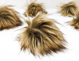 Golden brown faux fur pom pom.  Long pile fake fur fabric pom pom.