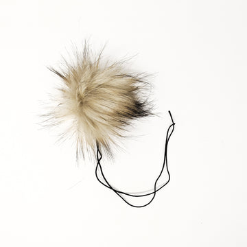 Latte faux fur pom pom with a thick nylon string.