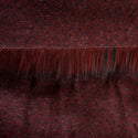 Backing of merlot faux fur fabric showing the long pile length of the fake fur. Merlot is a burgundy color faux fur fabric.