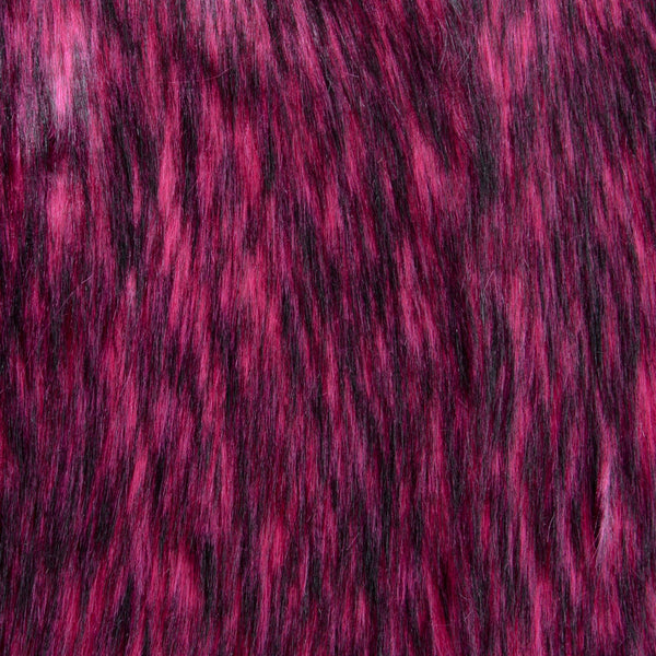 Long pile orchid pink faux fur fabric laid flat.