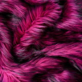Orchid pink faux fur fabric with folds.  A pink long pile fake fur fabric.