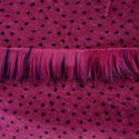 Backing of orchid pink faux fur fabric showing the long pile length of the fake fur.