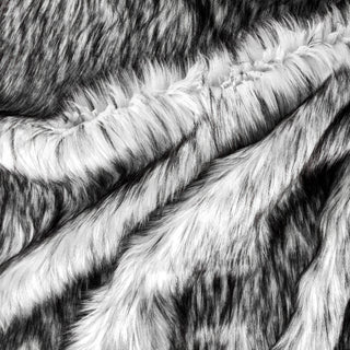 Backing of quartz faux fur fabric showing the long pile length of the fake fur. Quartz is a mix of black and white faux fur.