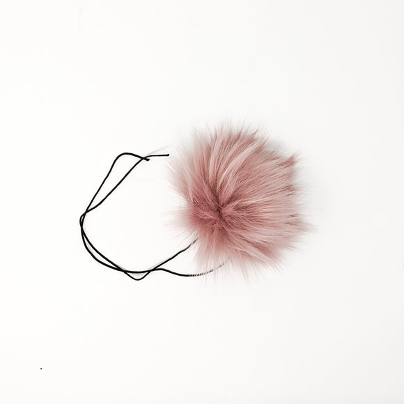 Rose blush faux fur pom pom with a thick nylon string.