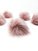 Rose blush faux fur pom poms.