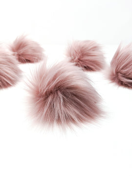 Rose blush faux fur pom poms.