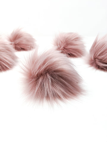 Rose blush faux fur pom poms.