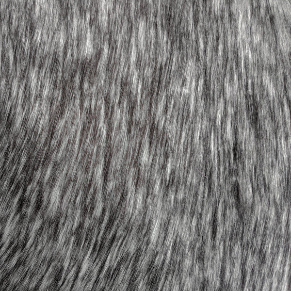 Long pile natural slate gray faux fur fabric laid flat.  Slate is a grey fake fur fabric.