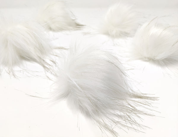 White faux fur pom pom.  White long pile fake fur fabric pom pom.